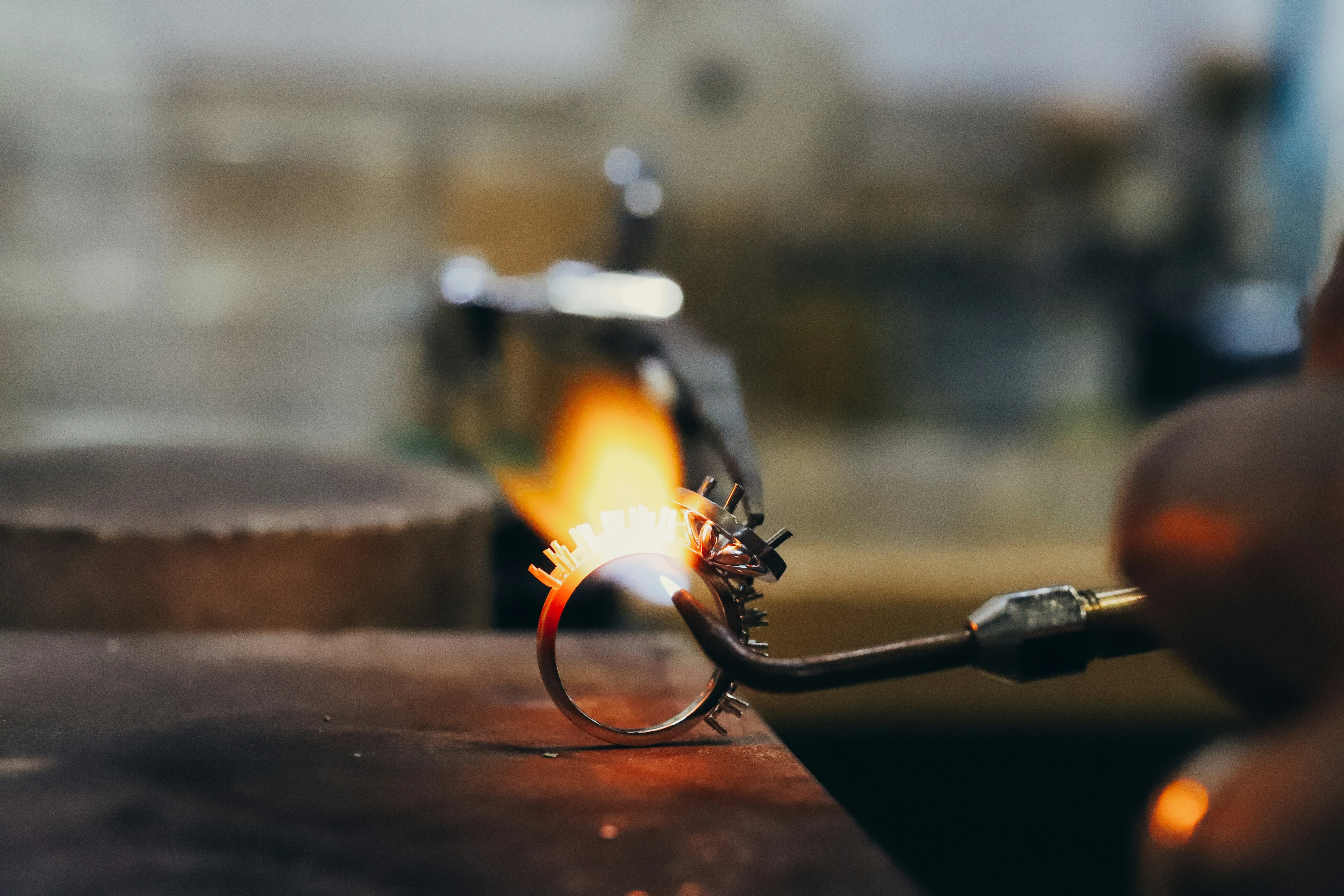 A jeweler crafting a diamond ring
