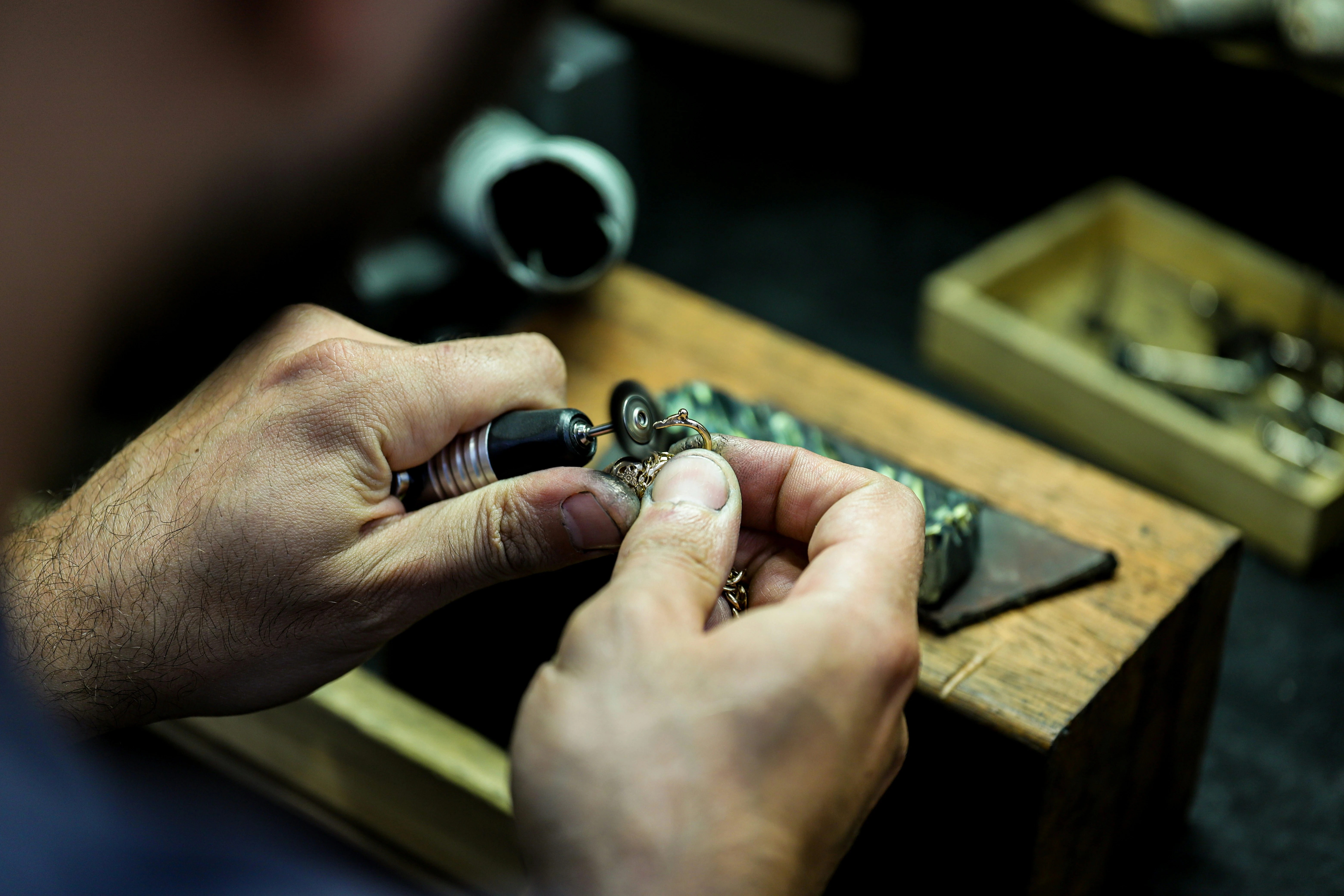 A jeweler presenting a diamond ring